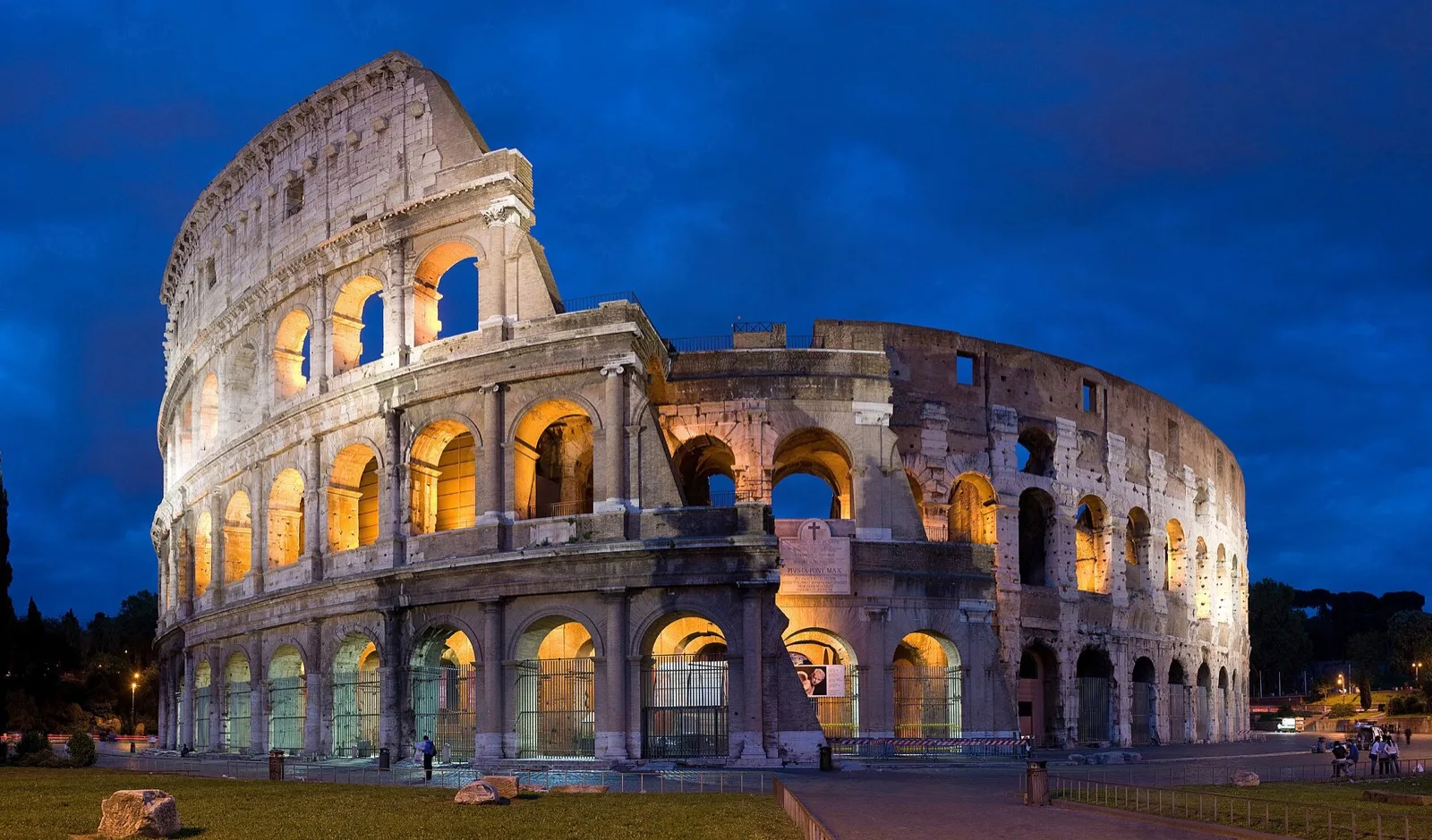 Interior of the Rome Colosseum lit up during a guided tour